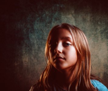 Closeup Photography Of Girls Face With Blonde Hair photo