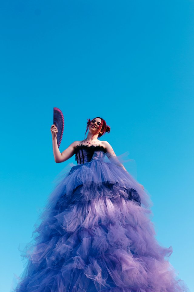 Woman In Black And Purple Ruffle Dress Holding Hand Fan