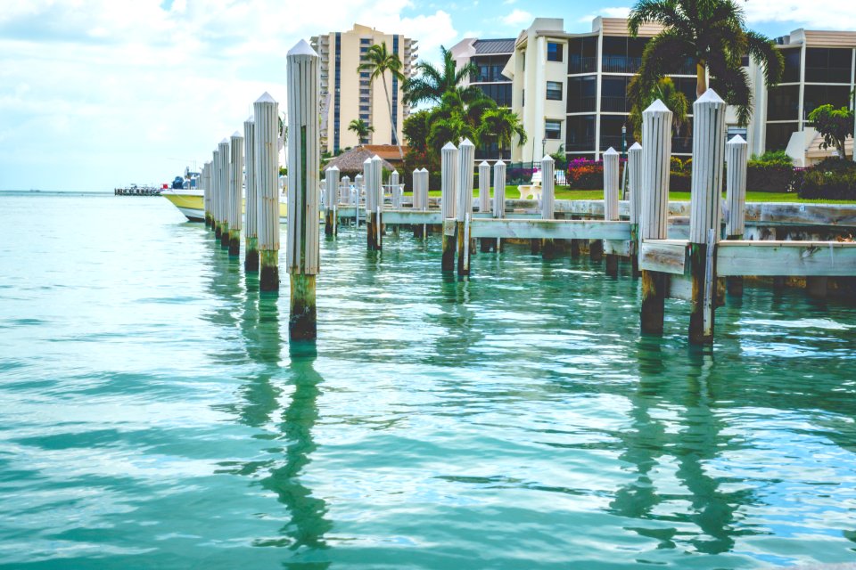 Photo Of White Wooden Dock On Body Of Water