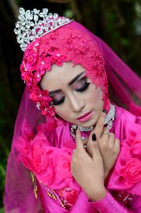 Woman In Pink Traditional Dress Wearing A Tiara photo