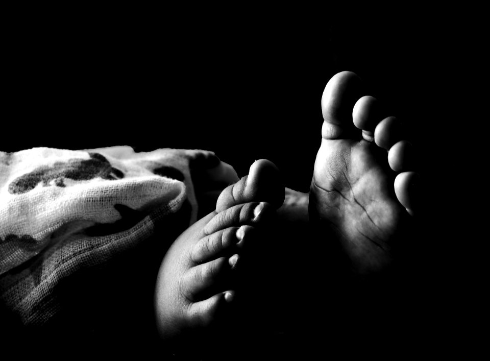 Grascale Photography Of Toddlers Foot