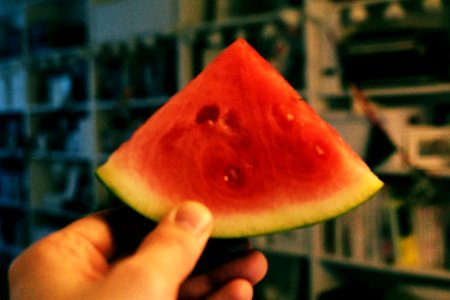Person Holding Sliced Watermelon photo