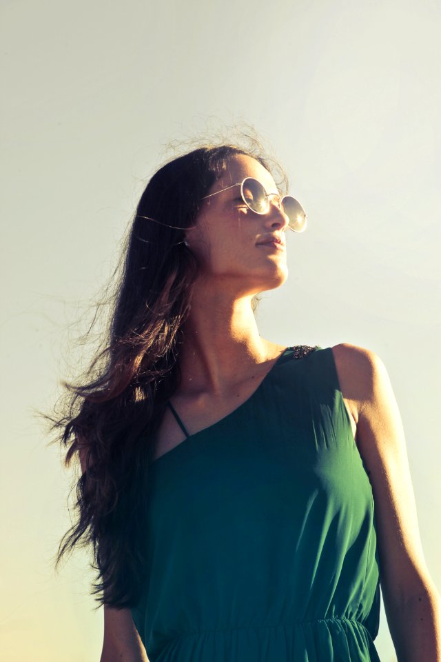 Photography Of A Woman Wearing Sunglasses