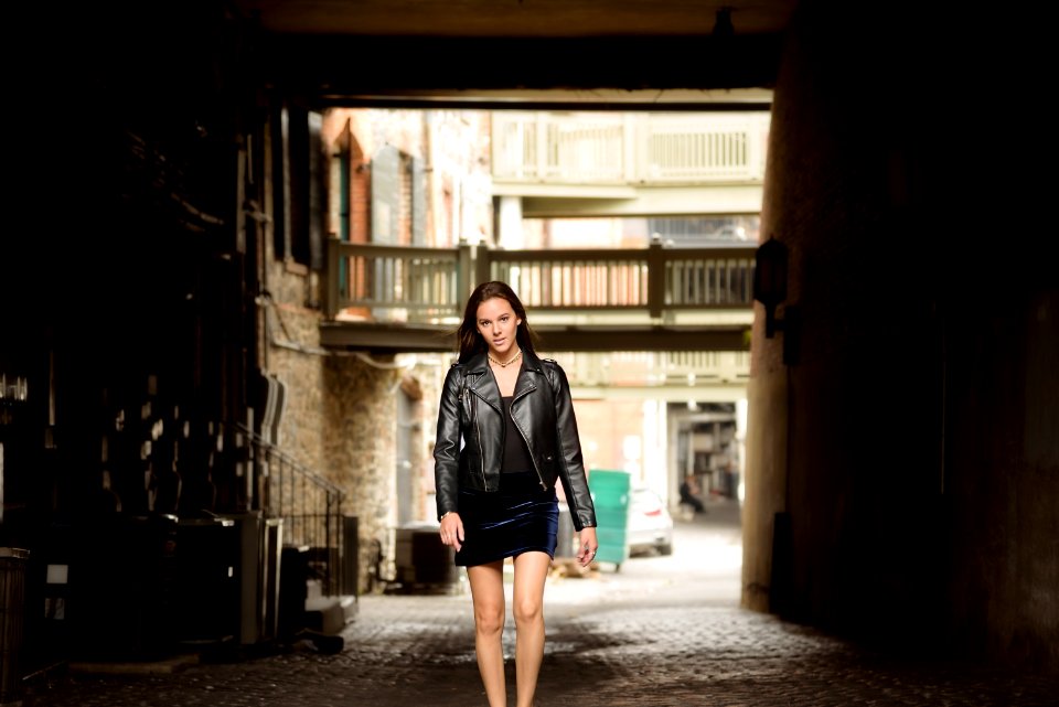 Woman In Black Leather Jacket And Skirt