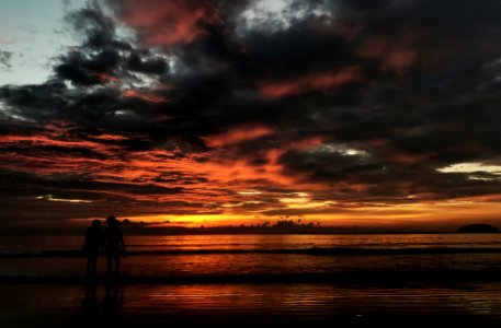 Two Person Standing On Beach Silhouette Photo photo
