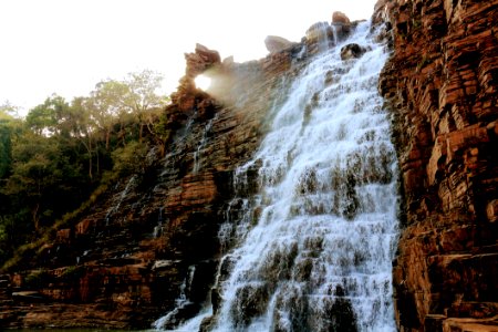 Waterfalls On Brown Rocky Mountain photo