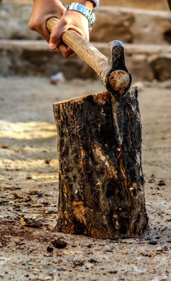 Photography Of A Person Chopping Wood