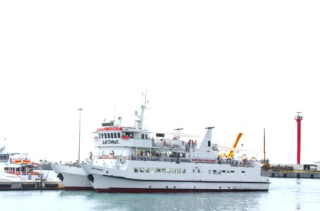 White Commuter Boat On Body Of Water photo