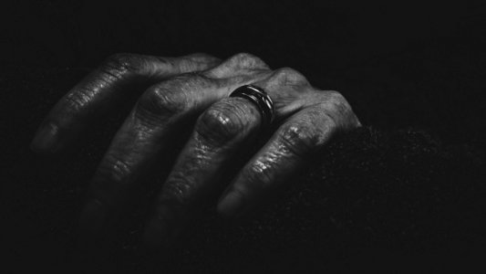 Close-Up Photography Of A Hand With Ring photo