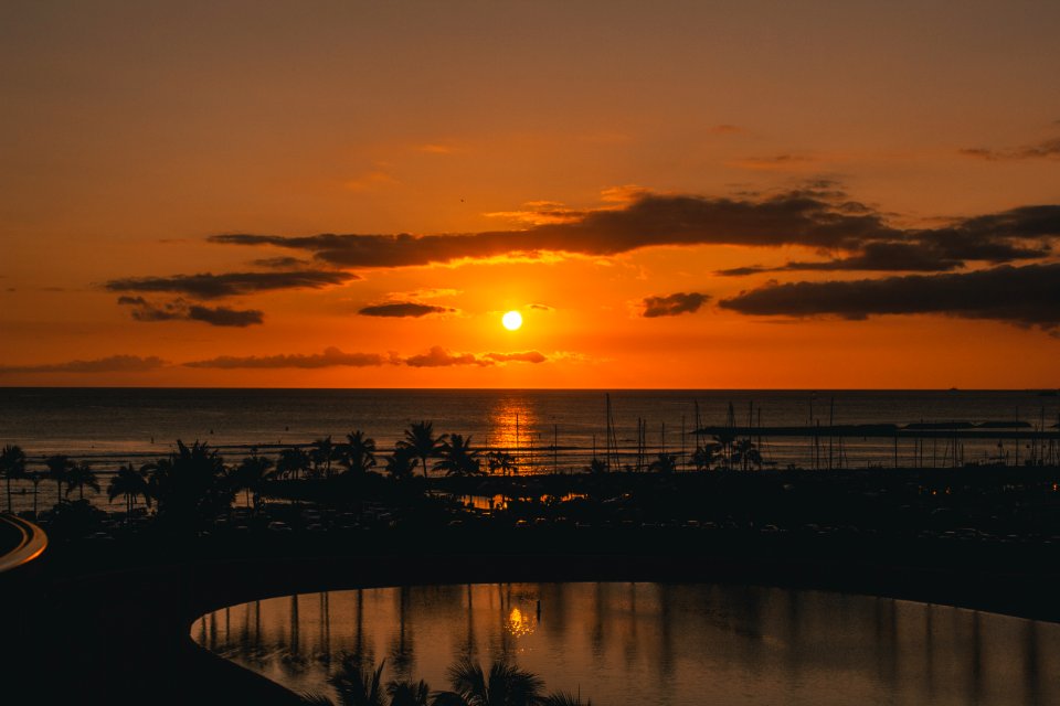 Silhouette Of Beach With Background Of Sunset