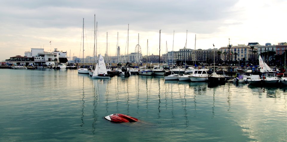 White Power Boat And Yacht Parked On Body Of Water photo