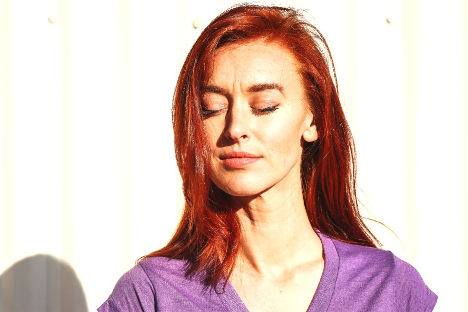 Close Up Photo Of Woman Wearing Purple Top