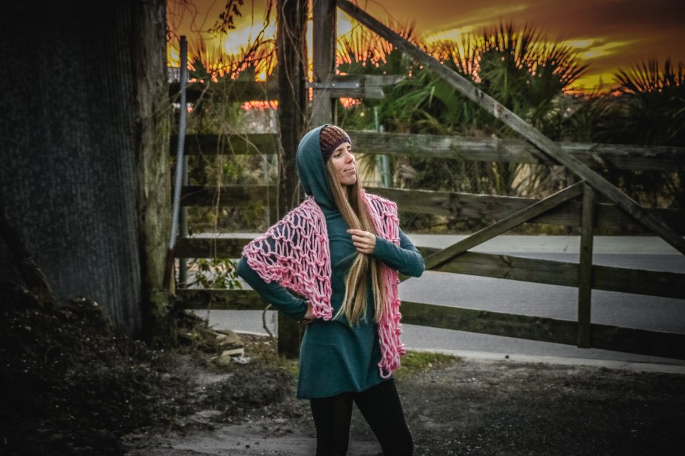 Woman In Green Long-sleeved Dress Standing Near Brown Wooden Fence photo