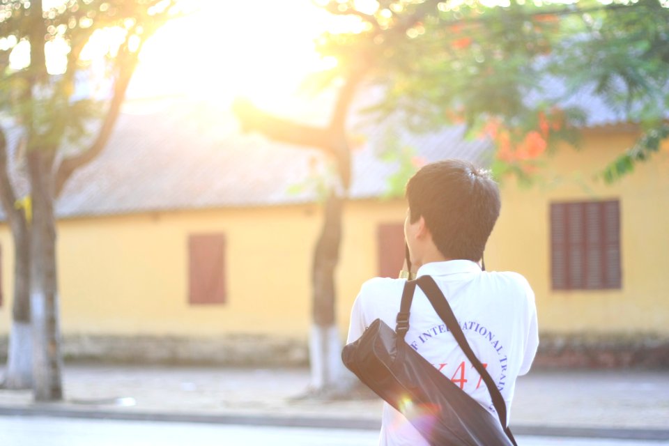 Man Wearing Polo Shirt With Bag
