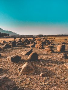 Rocks Near Trees And Mountains photo