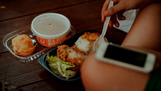 Person Holding White Disposable Spoon Eating Fried Chicken
