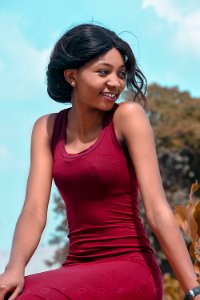 Close Up Photograph Of Woman Wearing Red Tank Top photo