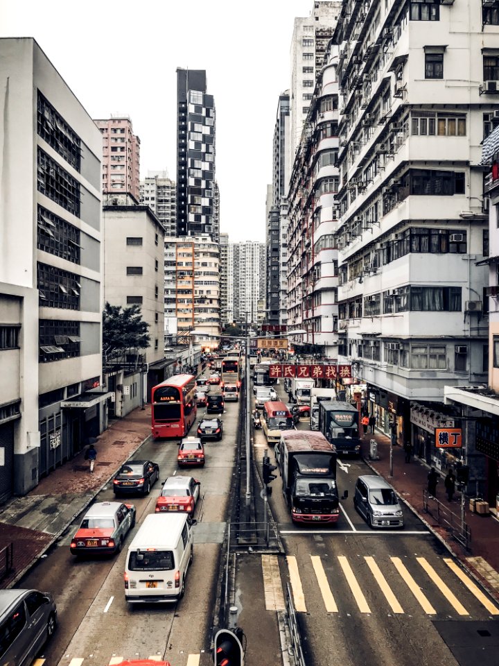 Photography Of Buildings And Cars On Road