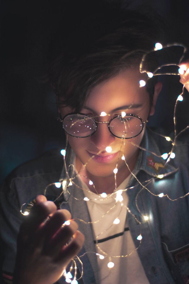Photography Of Man Wearing Eyeglasses