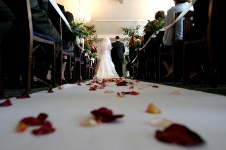 Bride And Groom Walking Down The Aisle