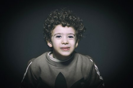 Boy Wearing Brown Sweatshirt photo