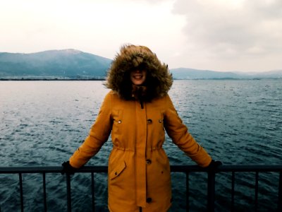 Woman In Yellow Winter Jacket photo