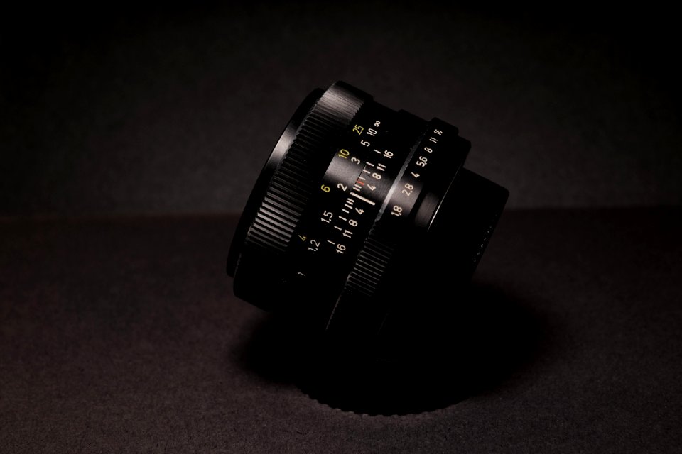 Black Camera Lens On Black Textile