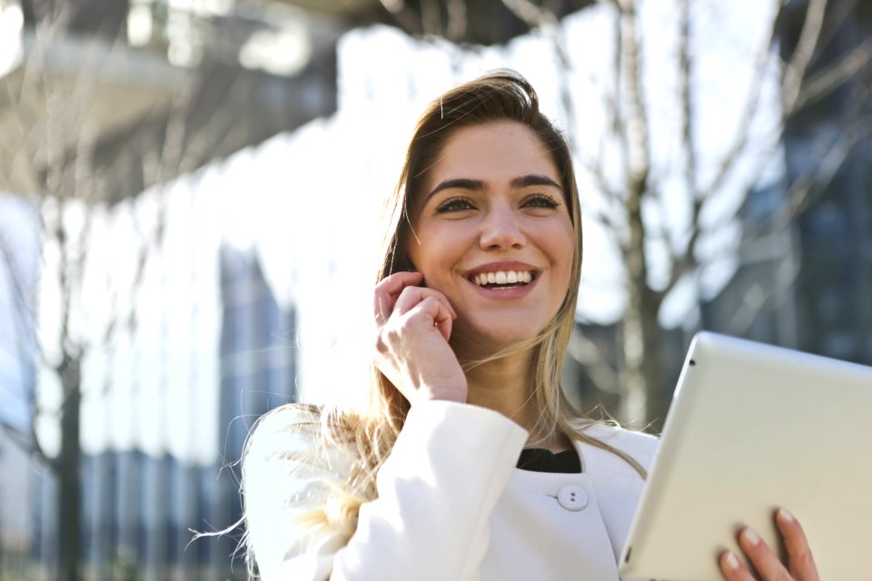 Woman In White Blazer Holding Tablet Computer