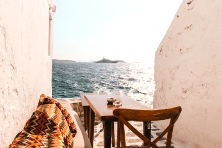 Table With Chair Beside The Sea photo