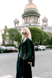 Womens Black Jacket And Black Skirt Near Building