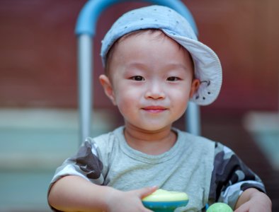 Depth Of Field Photo Of Boy Wearing Blue Cap photo