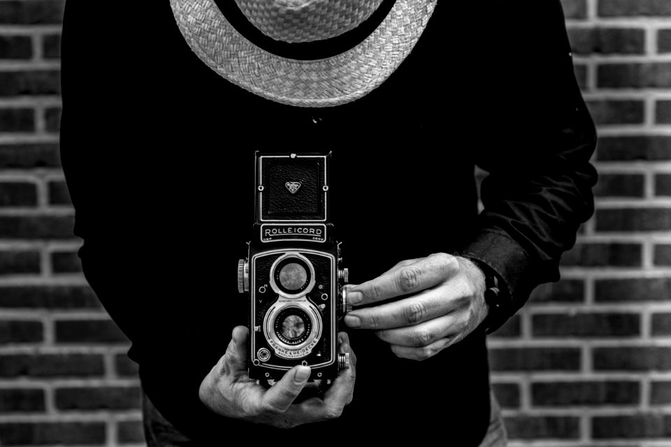 Photo Of Person Holding Vintage Camera