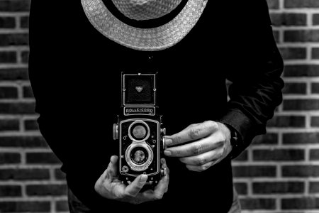 Photo Of Person Holding Vintage Camera photo