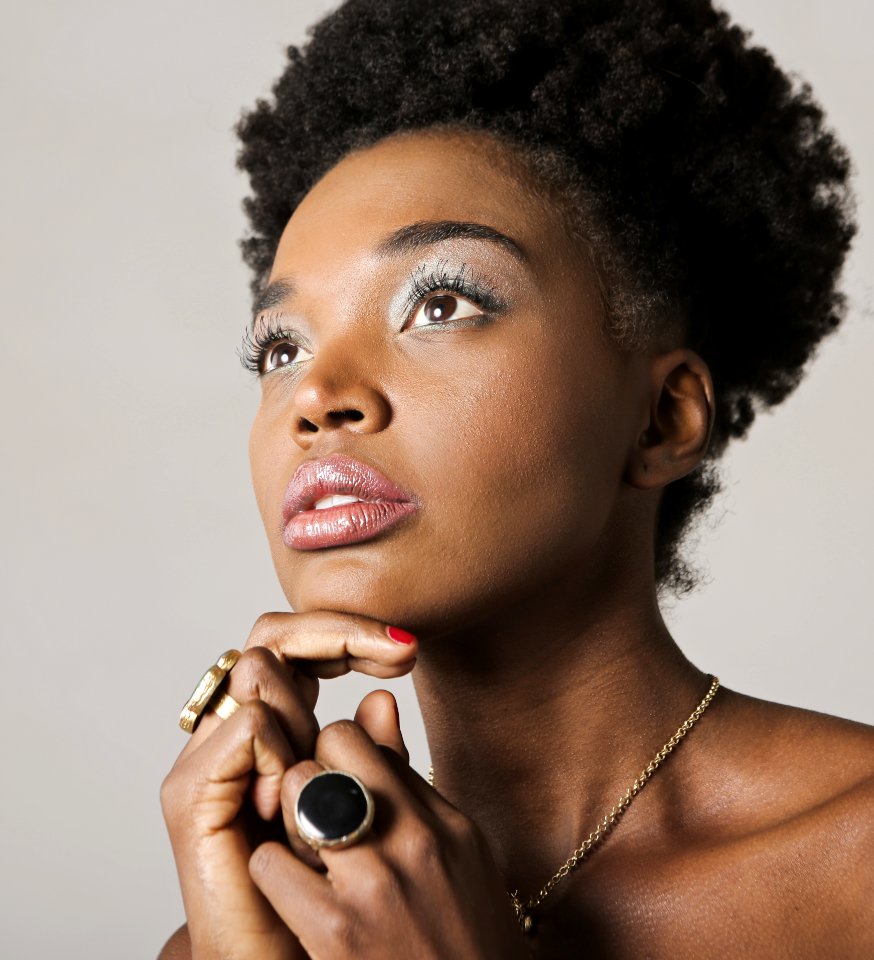 Woman With Gold-colored Accessories Taking Picture Inside Room photo