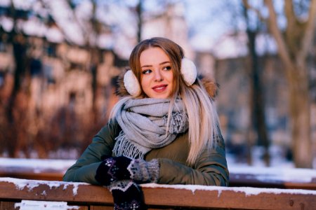 Woman Wearing Jacket Leaned On Wooden Rail photo