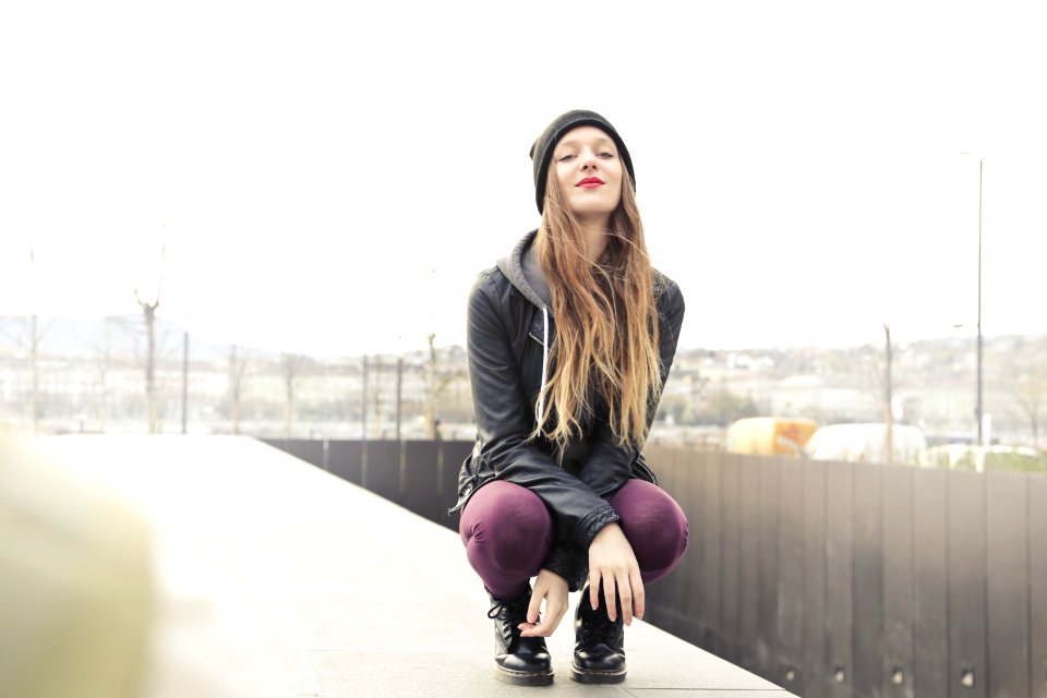 Selective Photo Of Woman In Gray Hooded Jacket Doing Crouch Position
