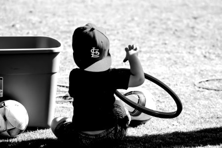 Grayscale Photo Of Boy Wearing St Louis Cap photo