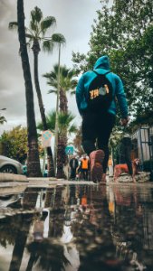 Person In Blue Hoodie With Black Backpack photo