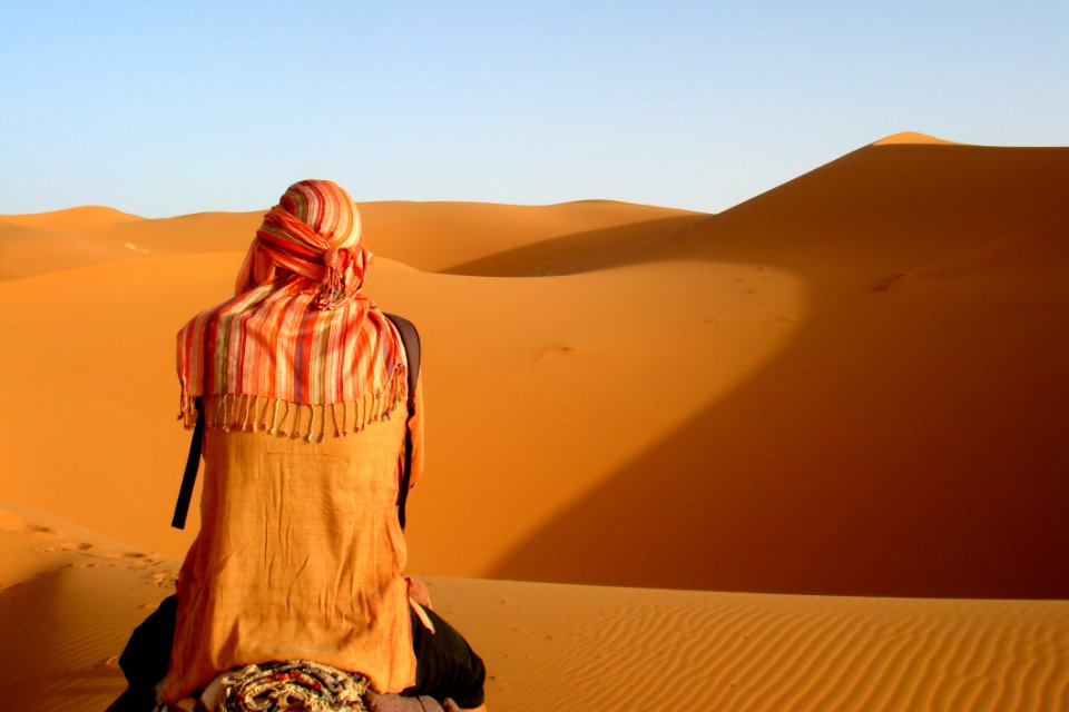 Person Camel Riding On Desert photo