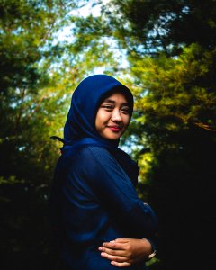 Woman In Blue Hijab And Abaya Traditional Dress photo