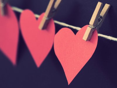 Photo Of Red Heart-shaped Paper Hanging On Rope photo