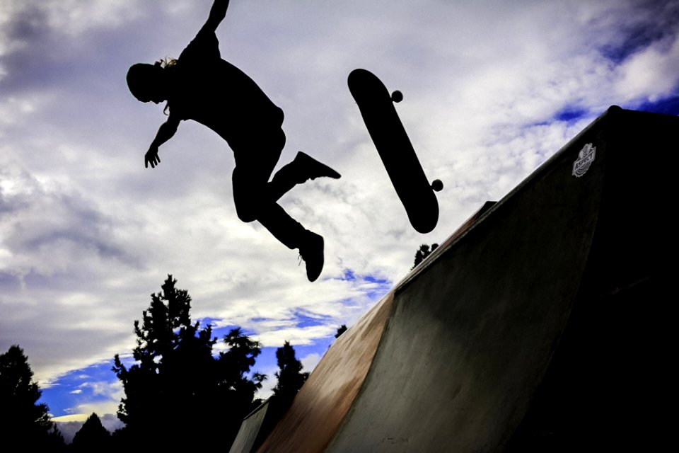 Silhouette Photo Of Person Doing Skateboard