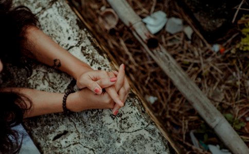 Black Haired Woman Wearing Black Beaded Bracelet photo