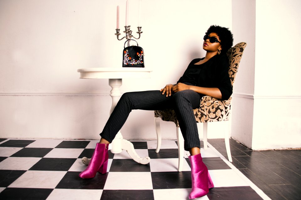 Woman Wearing Pair Of Purple Boots