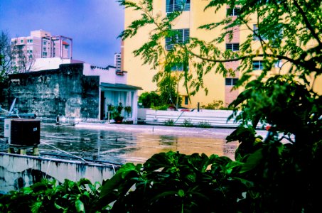 Yellow Concrete Building Near Body Of Water photo