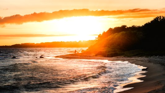 Gray Sand Beach During Sunset photo