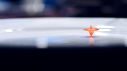 Orange Plastic Toy On White Surface photo