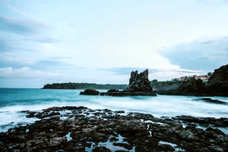 Photo Of Seashore With Rocks During Daylight photo