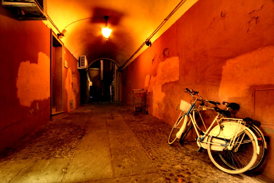 Two Beach Cruiser Bikes Beside Wall photo