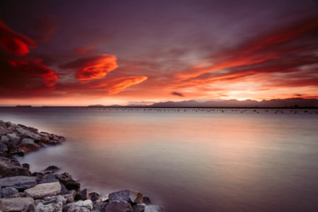 Landscape Photography Of Rocks Near Body Of Water During Sunset photo